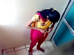 Some fledgling Indian brunette gals peeing in the toilet on spycam cam