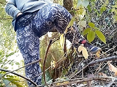 Curvy MILF with big stomach and huge ass in leggings drains outdoors