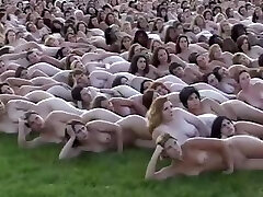 5000 naked people laying out for the camera operator who makes books