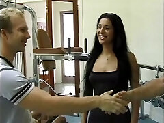 Brunette gets fucked in the gym by 2 guys