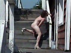 Really wild nympho uses a dildo to pet her wet pussy right outdoors