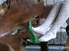 Blonde teen foot teasing in white and black stockings