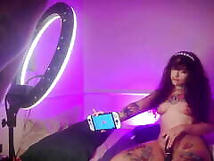 Behind the camera, my stepsister records herself while I edit