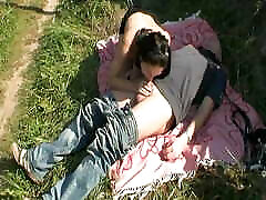 A sexy dark haired slut pleasing a cock out in public