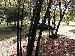 Outdoor fuck on the hood of the car with double penetration for young brunette