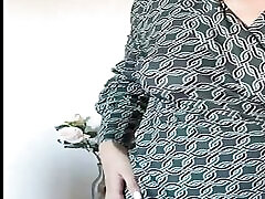 The beauty got excited while calling a friend and started masturbating with her fingers