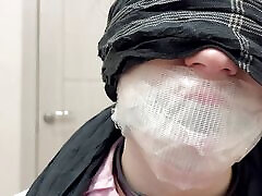 Tape tied to chair, ball gagged