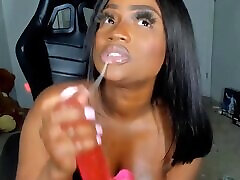 Curvy black student is passionately having fun with a dildo on a hot live broadcast.