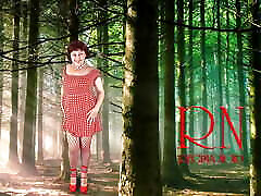 Pin-up lady posing in poice en forest. She shows her tits and pussy. Mesh tights. Special effect.