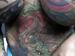 Busty tattooed slut gets fucked on the pool table by a massive black cock