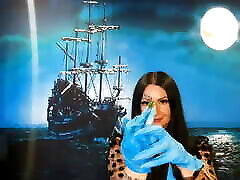 Glove fetish. Dominatrix Nika puts on medical gloves and tears them with her long nails. Latex gloves