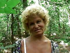 Blonde hairy mature is jumping on big dong outdoors