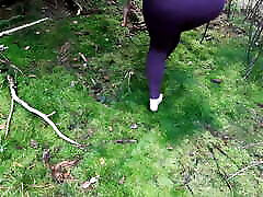 Barefeet tit slapping in the woods
