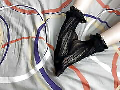 Caressing long legs of girl in black lace socks