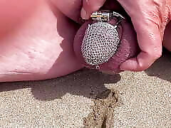 Piss in a chastity cage outdoors in front of his wife
