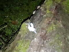 Twink jerking off cock in nature riverbank