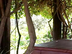Slutty brunette invites the peeping gardener over and takes his cock up her ass outdoors