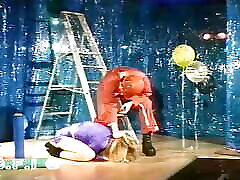 Blonde woman wrapped in foil gets tormented