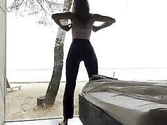 sexy goddess stretching yoga by the sea