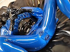 alixy fowx teaser - Blue latex catsuit with integrated vaginal and anal condoms!
