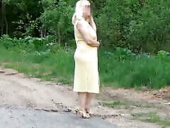 Summer milf walking naked of the road