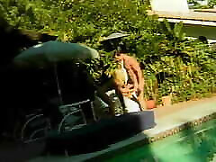 Gorgeous blonde rides big dick by the pool