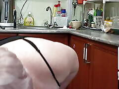 Mother-in-law masturbates with toys in the kitchen