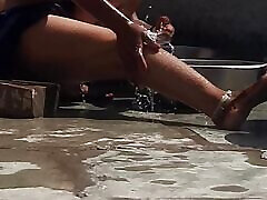 Desi sister-in-law is taking a bath in an open bathroom near the road on the edge of the forest on the farm