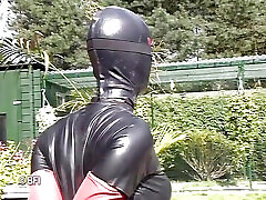 Leather woman gets dominated outdoor