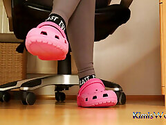Under Desk Foot Play - Pink Clogs and Worn Socks