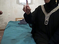 muslim woman in hijab helps older man with his erection problem