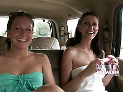 Two hot chicks get off in a moving car