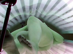 MILF masturbating in solarium