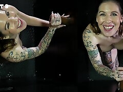 Heavily tattooed babe Nikki Zee on her knees sucking cocks in HD