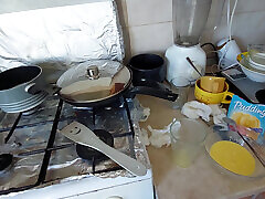 Sexy wife prepares breakfast naked in the kitchen.