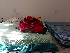 Mexican mother-in-law cleaning guest room in thong