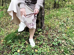 Milf walks in the forest without panties, pees