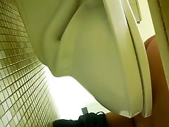 College bathroom under the stall peek