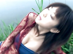 Glamorous Asian chick Aki Hoshino poses in her furry coat