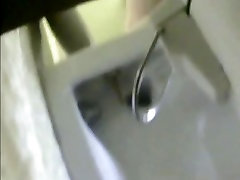 Spy device in a beach toilet watching moms pusseys pee