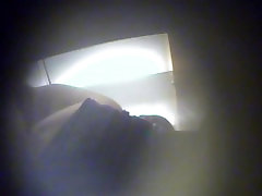 Fem in dressing room leans forward and her tits bounce