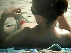 The downblouse cute sex young small sex becomes an object of a hidden spy cam on the beach