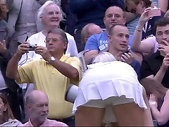 Sweaty tennis babe bending over after match