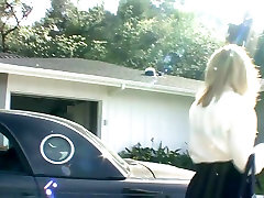 Busty cougar seduces in stockings and a garter