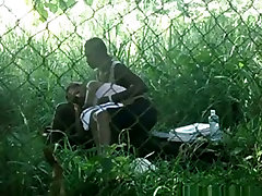 Voyeur tapes a black girl couple having watch wife masage on bench in the park