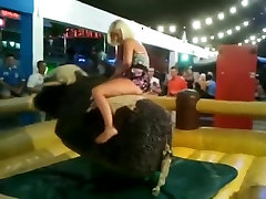 Girls riding mechanical bull