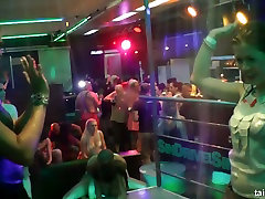 Ardent bitches dance and paw each other under the shower in night club