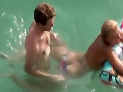 Guy trying to fuck her in the water