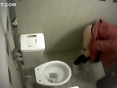 Blonde filmed from above when taking a pee