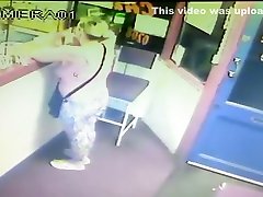Blonde woman pisses right in front of the receptionists desk